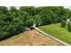Aerial shot of the property with animal shelter and playground surrounded by green pastures at 141 Mills Creek Path, Hiram, GA 30141