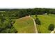 Sprawling acreage with green pastures, mature trees, and a long driveway at 141 Mills Creek Path, Hiram, GA 30141