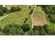 Vast acreage features green pastures, wooded areas, and a long driveway at 141 Mills Creek Path, Hiram, GA 30141