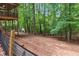 Wooded backyard with a chicken coop and screened porch at 141 Mills Creek Path, Hiram, GA 30141