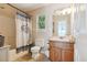 Bathroom with a decorative shower curtain, toilet, and cabinet with sink at 141 Mills Creek Path, Hiram, GA 30141