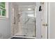Modern bathroom showcasing a glass enclosed shower with tiled walls and built-in shelving at 141 Mills Creek Path, Hiram, GA 30141