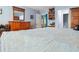 Cozy bedroom with light blue walls, wooden dresser, and view into other rooms at 141 Mills Creek Path, Hiram, GA 30141