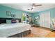 Comfortable bedroom with a ceiling fan, bed, and a door leading to a balcony at 141 Mills Creek Path, Hiram, GA 30141