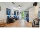 Spacious bonus room with recliners, ceiling fan, and an exterior door with a porch at 141 Mills Creek Path, Hiram, GA 30141