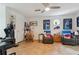 Bonus room featuring recliners, ceiling fan, and Buffalo Bills themed decor at 141 Mills Creek Path, Hiram, GA 30141