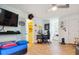 Large bonus room with TV, desk, and Buffalo Bills themed decor at 141 Mills Creek Path, Hiram, GA 30141
