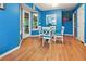 Dining area featuring blue walls, a glass table, and cushioned chairs at 141 Mills Creek Path, Hiram, GA 30141