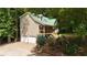 Charming home with green metal roof, stone accents, and a welcoming front porch at 141 Mills Creek Path, Hiram, GA 30141