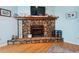 Living room fireplace, stone surround and hearth, with a mantel, decor and hardwood floors at 141 Mills Creek Path, Hiram, GA 30141