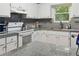 View of the kitchen, with gray granite countertops and white cabinets at 141 Mills Creek Path, Hiram, GA 30141