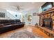 Inviting living room with a stone fireplace, comfortable seating, and natural light at 141 Mills Creek Path, Hiram, GA 30141