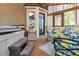 Cozy screened porch with hot tub, comfortable seating, and access to the outdoors at 141 Mills Creek Path, Hiram, GA 30141