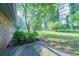 Green backyard featuring lush greenery and a patio space, great for entertaining or relaxing outdoors at 2173 Martin Way, Jonesboro, GA 30236
