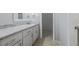Bathroom vanity with granite counter and tile floor at 2173 Martin Way, Jonesboro, GA 30236