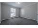 Bedroom with neutral colors, carpet and a window at 2173 Martin Way, Jonesboro, GA 30236