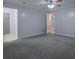 Bedroom with gray carpet, closet, and ceiling fan at 2173 Martin Way, Jonesboro, GA 30236