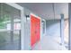 Gray covered entrance with red doors and accent lights at 2173 Martin Way, Jonesboro, GA 30236