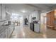 Bright, tiled kitchen with granite counters, breakfast nook, black appliances and updated white cabinetry at 2173 Martin Way, Jonesboro, GA 30236
