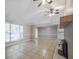 Spacious living room featuring tile flooring, a fireplace, and abundant natural light from the large window at 2173 Martin Way, Jonesboro, GA 30236