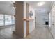 Open concept living room with fireplace feature, tile floors, and view to kitchen at 2173 Martin Way, Jonesboro, GA 30236