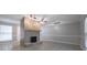 Open living room with central fireplace feature, tile floors, and vaulted ceilings at 2173 Martin Way, Jonesboro, GA 30236