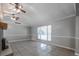 Spacious living room featuring tile floors, updated lighting, and a bright window view at 2173 Martin Way, Jonesboro, GA 30236