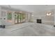 Unfinished basement with a fireplace, sliding doors and windows allowing light in the home at 2991 Surrey Ln, Atlanta, GA 30341