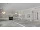 Unfinished basement with a fireplace and windows allowing light in the home at 2991 Surrey Ln, Atlanta, GA 30341