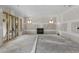 Unfinished basement with a fireplace, sliding doors and windows allowing light in the home at 2991 Surrey Ln, Atlanta, GA 30341