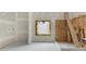 Bathroom under construction featuring a window and exposed plumbing at 2991 Surrey Ln, Atlanta, GA 30341