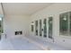 Spacious covered patio with brick fireplace and multiple windows overlooking backyard at 2991 Surrey Ln, Atlanta, GA 30341