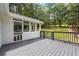 Back deck with railing looking out onto a lawn at 3345 Bomar Rd, Douglasville, GA 30135