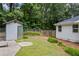 Exterior shot of a backyard featuring a small shed at 3345 Bomar Rd, Douglasville, GA 30135