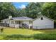 Back exterior of home with stairs, pool, picnic table, and fenced in backyard at 3345 Bomar Rd, Douglasville, GA 30135