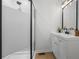 Bathroom with glass enclosed shower stall and modern white vanity at 3345 Bomar Rd, Douglasville, GA 30135