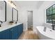 Modern bathroom with double vanity, soaking tub, and elegant fixtures at 3345 Bomar Rd, Douglasville, GA 30135