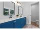 Bathroom featuring a double sink vanity, modern fixtures and natural lighting at 3345 Bomar Rd, Douglasville, GA 30135