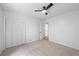 Bedroom featuring carpet, ceiling fan, and large closet at 3345 Bomar Rd, Douglasville, GA 30135
