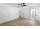Large bedroom with wood floors, ceiling fan, and private bath at 3345 Bomar Rd, Douglasville, GA 30135