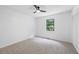 Bedroom with carpet, ceiling fan, and large closet at 3345 Bomar Rd, Douglasville, GA 30135