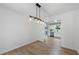 Bright dining area with modern lighting and views into the kitchen at 3345 Bomar Rd, Douglasville, GA 30135