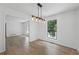 Dining room boasting a modern chandelier and a large window with natural light at 3345 Bomar Rd, Douglasville, GA 30135