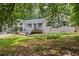 Beautiful two-story home featuring new exterior paint and a large front yard with mature trees at 3345 Bomar Rd, Douglasville, GA 30135