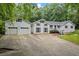 Charming two-story home with attached two-car garage and inviting curb appeal at 3345 Bomar Rd, Douglasville, GA 30135