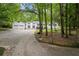 Charming two-story home with attached two-car garage and inviting curb appeal on a wooded lot at 3345 Bomar Rd, Douglasville, GA 30135
