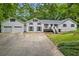 Charming two-story home with attached two-car garage and inviting curb appeal at 3345 Bomar Rd, Douglasville, GA 30135