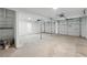 Spacious two car garage with high ceilings, white walls, and concrete floors at 3345 Bomar Rd, Douglasville, GA 30135