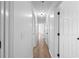 Bright hallway with hardwood floors, leading to multiple rooms at 3345 Bomar Rd, Douglasville, GA 30135