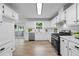 Beautiful kitchen features white cabinets, stainless appliances, and modern countertops at 3345 Bomar Rd, Douglasville, GA 30135